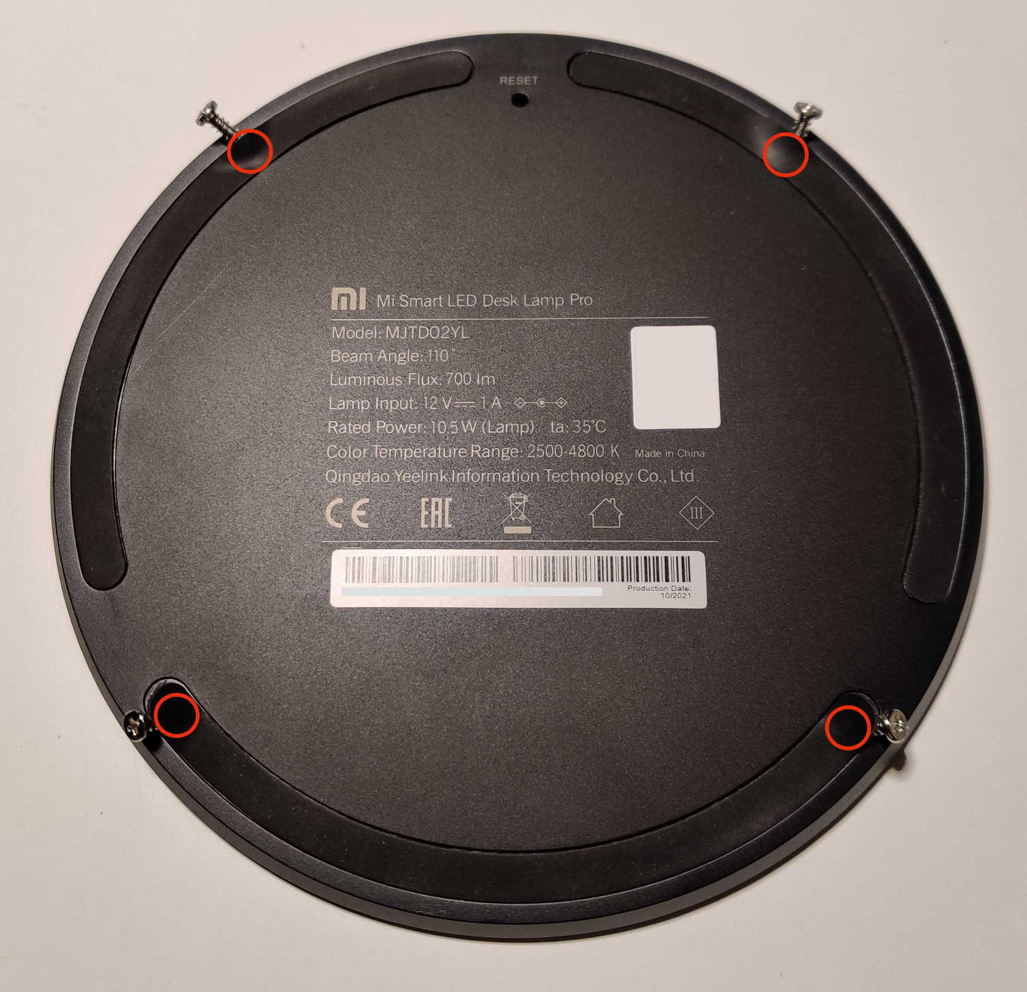 a Picture of the four screws and where they are placed under the rubber feet. a Picture of the four screws and where they are placed under the rubber feet.